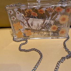 Acrylic purse with a flower motif